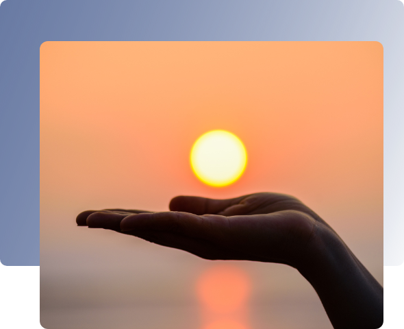 mano sujetando el sol